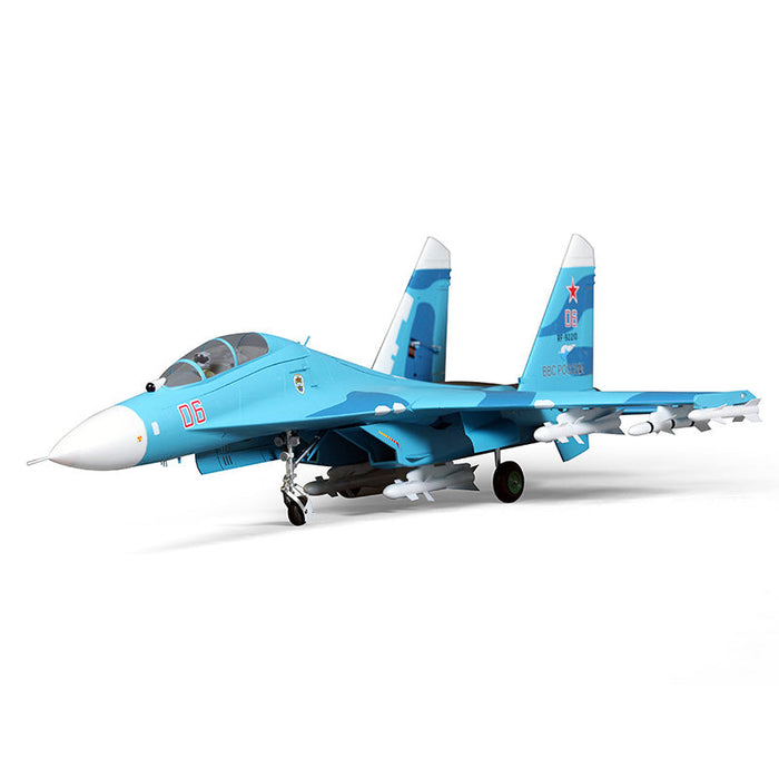 FMS SU-27 RC model in light blue with missile details, perfect for enthusiasts.