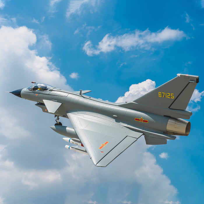 Gray J-10 EDF jet flying against a blue sky, featuring realistic markings and ordnance