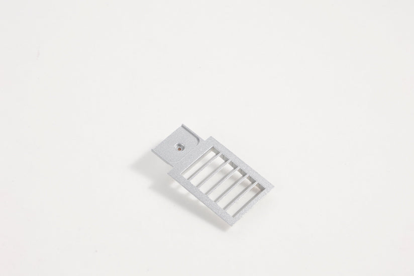 Gray air grill accessory for RC airplane fuselage.