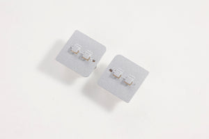 Gray landing gear base connectors for RC models.